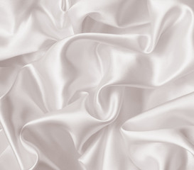 Fototapeta premium Smooth elegant golden silk as wedding background. In Sepia toned