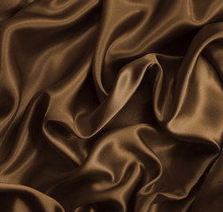 Smooth elegant golden silk as background. In Sepia toned. Retro