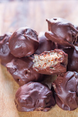 Homemade Raw Chocolate Truffles on Dark Wooden Background, Close-up
