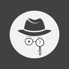 Detective. Spy. Unknown man in hat, glasses and a magnifying glass in hand.
