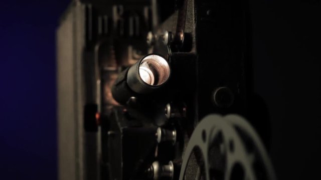 Old film projector playing film 