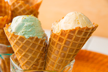Waffle cones with italian pistachio and vanilla gelato ice cream