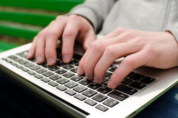 Fototapeta na wymiar Young man using his laptop 