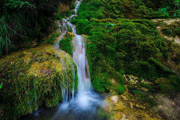 Naklejka na ściany i meble Waterfall in carpathian mountains