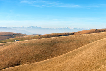 Fototapeta na wymiar Plateau of Lessinia and Italian Alps, Adamello, Presanella and Brenta