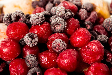 Close up of frozen mixed fruit, berries - cherry, raspberry, bla