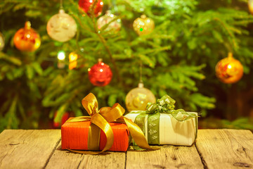 Decorated and illuminated Christmas tree on indistinct, blurred and  fairytale background.
