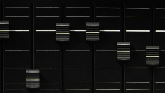 Faders of a digital audio workstation mixer