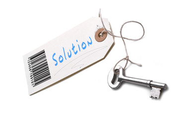 A silver key with a tag attached with a Solution concept written on it.