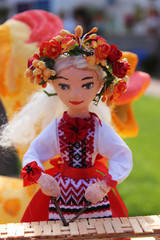 Dolls musicians. female dolls in wreaths Ukrainian clothes play