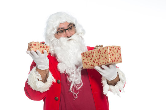  Portrait of happy Santa Claus holding  Christmas gifts