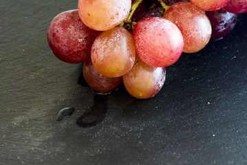 Bunch of grapes on a stone slate