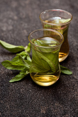 fresh mint tea on dark  table, arabic style.