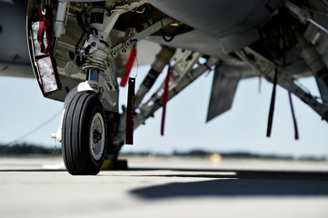 Fighter aircraft detail with landing gear - obrazy, fototapety, plakaty