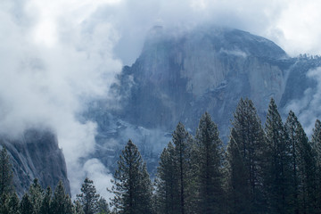 Half Dome surrounded by clouds