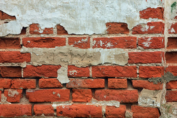 texture of old dilapidated shabby brickwork of red brick wall fo