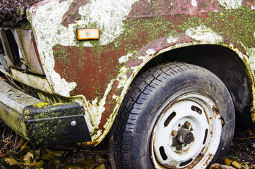 front fender of a rusty old car