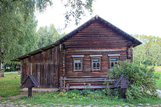 beautiful vintage traditional Russian log house with wooden wind