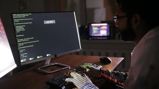 Hacker's hands typing codes on the keyboard. Hacks program code, software code. HD.