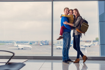 Family waiting for departure at airport