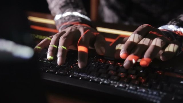 Hacker's hands typing codes on the keyboard. Hacks program code, software code. HD.