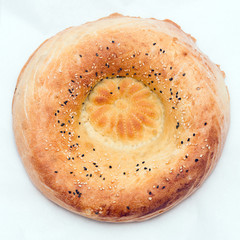 Traditional bread peoples of Central Asia - flat bread, baked in the tandoor oven
