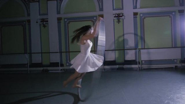 Her life is circus. Woman rotate on cyr wheel.