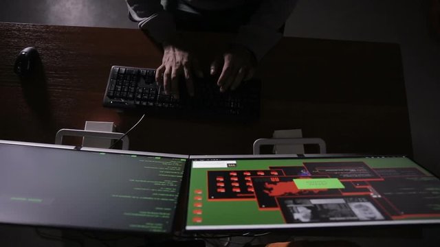 Arabic IT specialist working on computer at night. Hacker breaking computer code. HD.