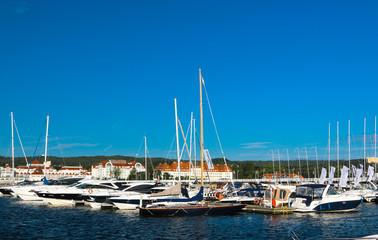 Fototapeta premium The longest wooden mall in Europe. View of the city and the waterfront. Ships.