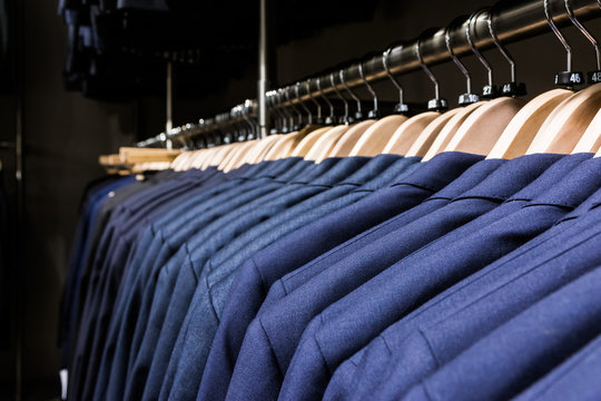 Blazer Jacket on Rack in Store Men Fashion Wooden Hangers Clothe