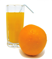 Glass of orange juice with yellow orange and tubule