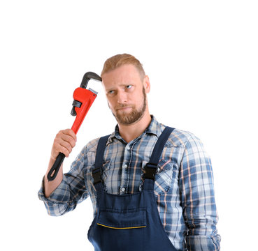 Portrait of funny plumber with pipe wrench isolated on white