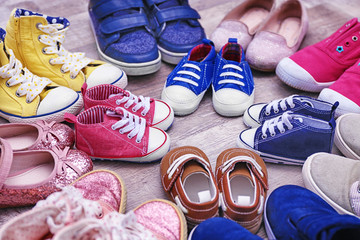 Colorful kids shoes on floor