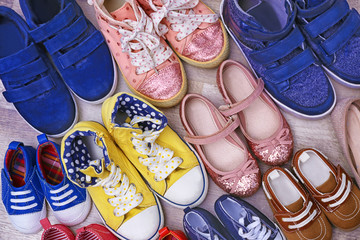Colorful kids shoes on floor