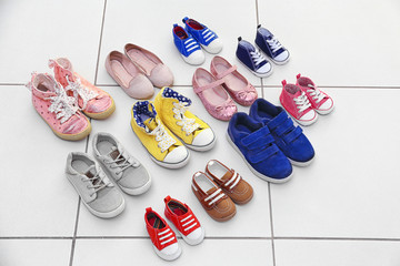 Colorful kids shoes on floor