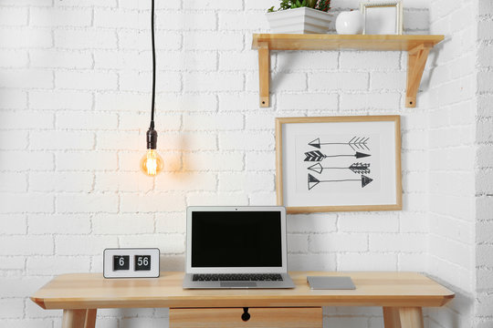 Work place interior design with light bulb on wire