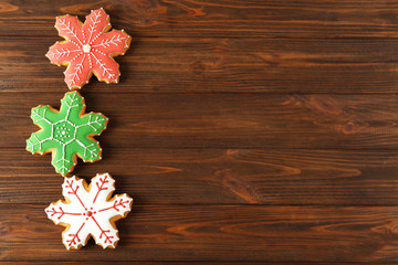 Obraz na płótnie Canvas Tasty Christmas tasty cookies on wooden background