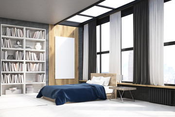 View of bedroom with poster and bookcase