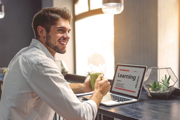 Young man spending time in coffee shop