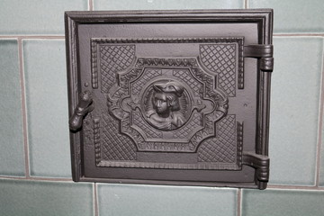 black metal flap at the oven
