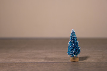 one toy Christmas tree as the background to a Christmas card substrate. Background for cards, very empty place for text