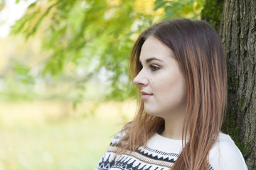 Naklejka premium A young girl in nature