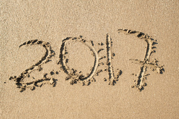Inscription 2017 on the sand
