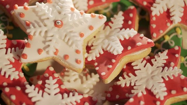 Video 4k, decorating cookies of ginger cake for Christmas. multi-colored cookies. Multi-colored a liver for Christmas. Beautiful cookies. Festive cookies. The tasty decorated cookies. It is a lot of