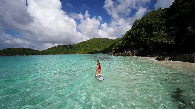 Aerial view of a bikini woman walking out to snorkel, st john, United States Virgin Islands 