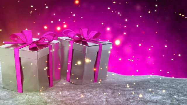 Christmas gifts in snow on pink bokeh background. Seamless loop. 3D render.