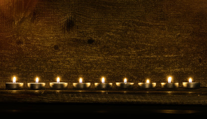 tea candles on a wooden background