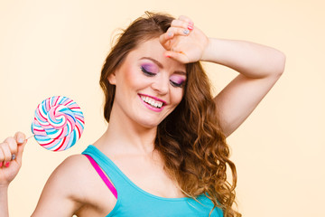 Woman joyful girl with lollipop candy