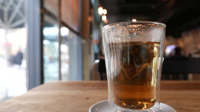 hot tea close up, teabag and steam
