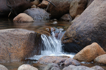 Fototapeta na wymiar Water flows through rocks, Sauk River, WA